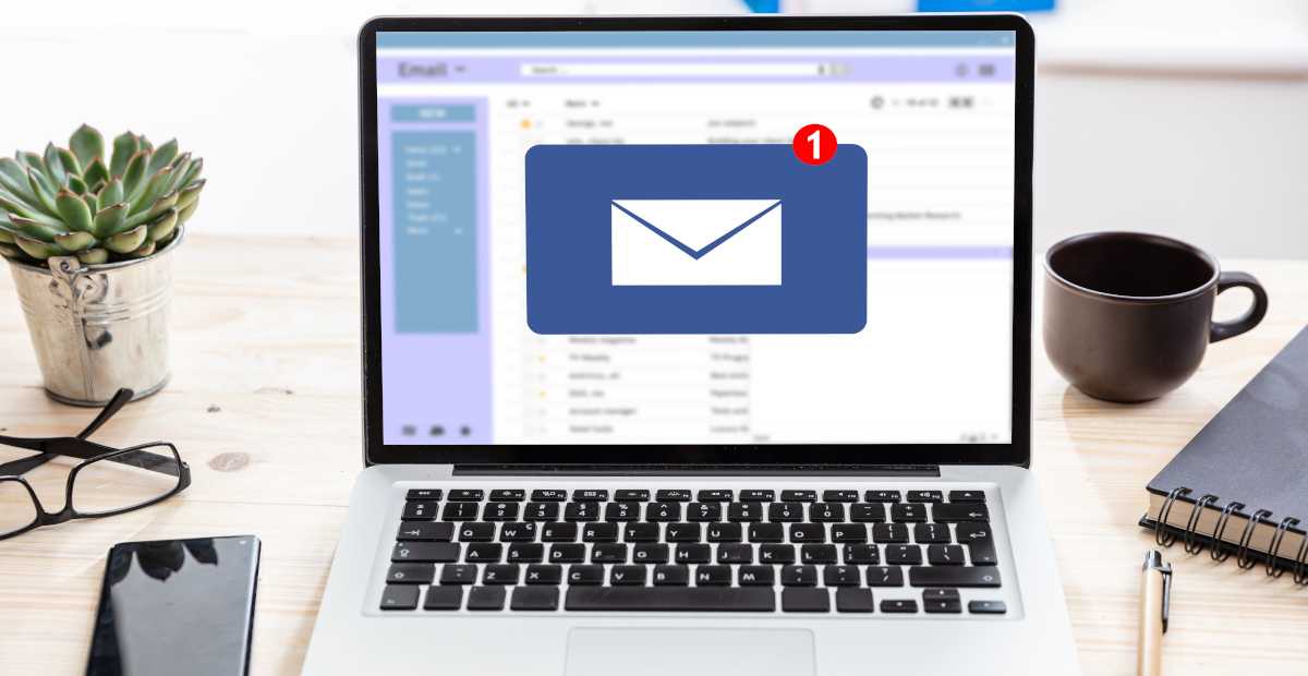 Email message inbox notification on laptop screen, business background