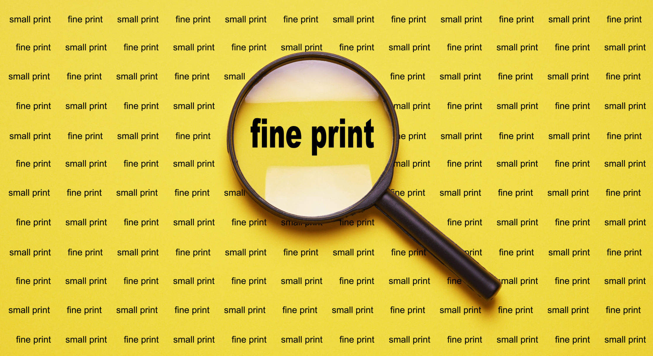 fine print enlarged with magnifying glass magnifier loupe