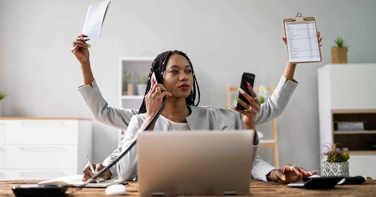 Multitasking Businesswoman In Office