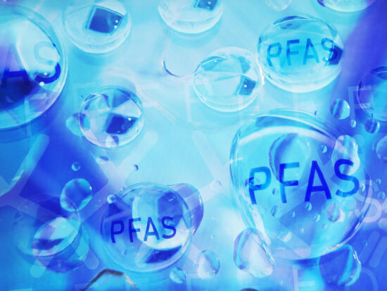Water droplets with PFAS text -- Forever chemical water contamination concept
