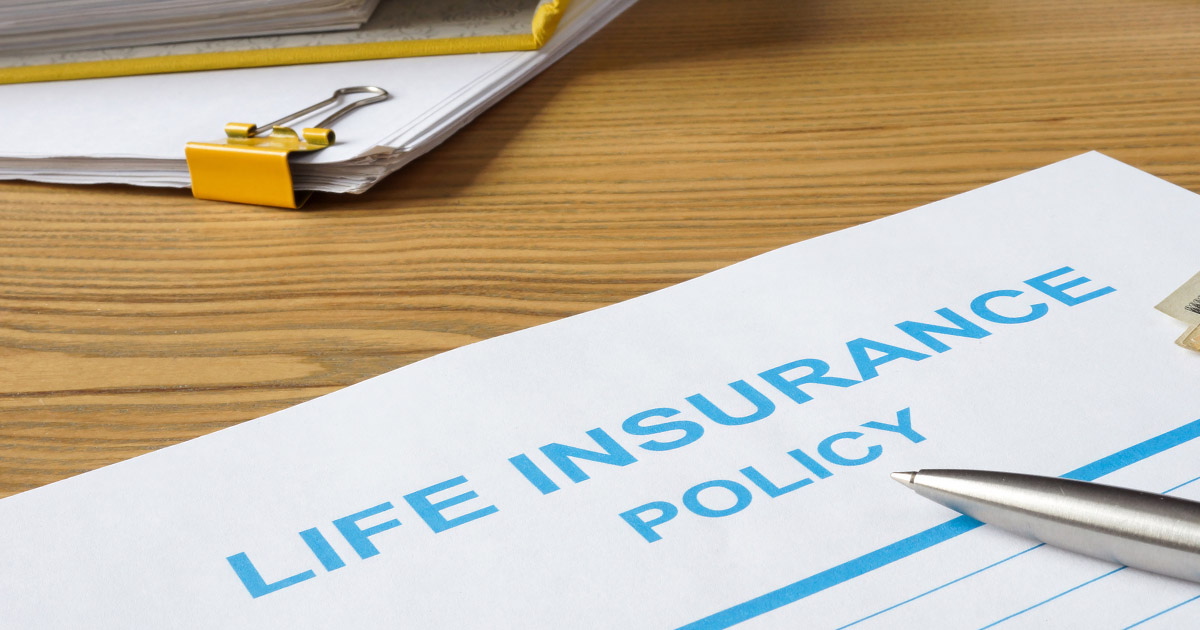 Life insurance policy, money and documents.
