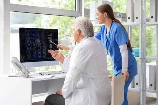 https-www-hq-law-com-wp-content-uploads-2026-10-doctor-reviewing-mri-with-patient-american-compresso-1024x683-jpg