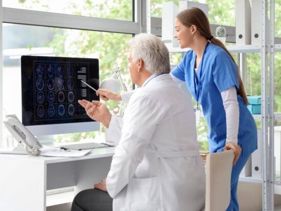 https-www-hq-law-com-wp-content-uploads-2026-10-doctor-reviewing-mri-with-patient-american-compresso-1024x683-jpg
